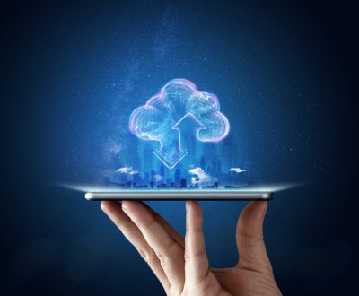Creative background, male hand with the phone, the image of the hologram of the cloud, blue background. The concept of cloud technology, cloud storage, a new generation of networks. Mixed media.